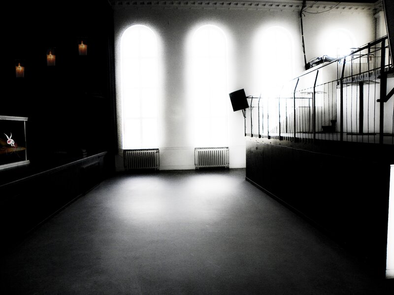 Empty hall with arched windows