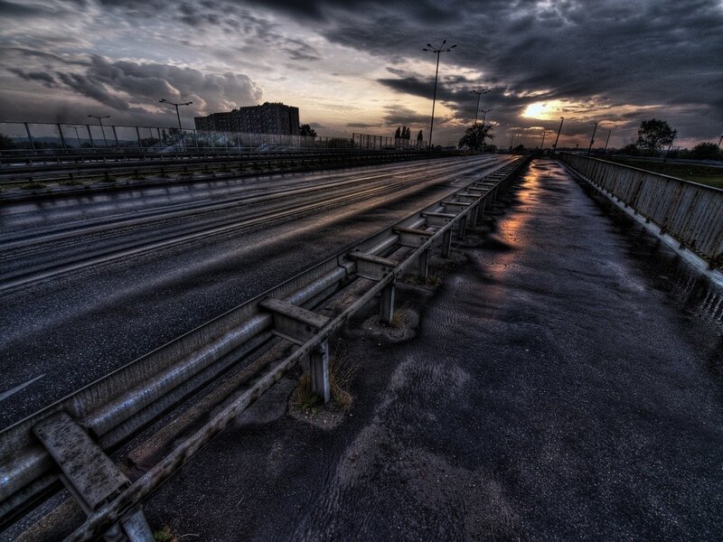 Empty highway at sunset