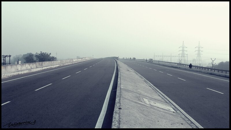 Empty highway in foggy weather