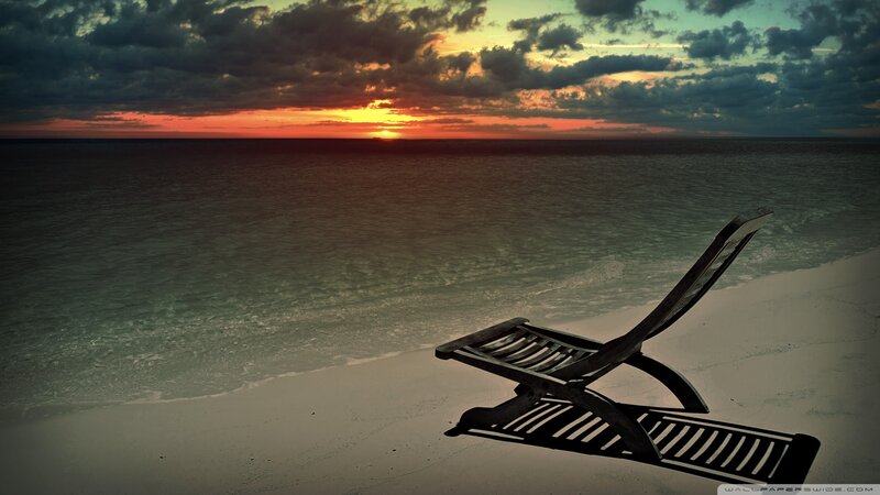 Empty Lounge Chair on Beach