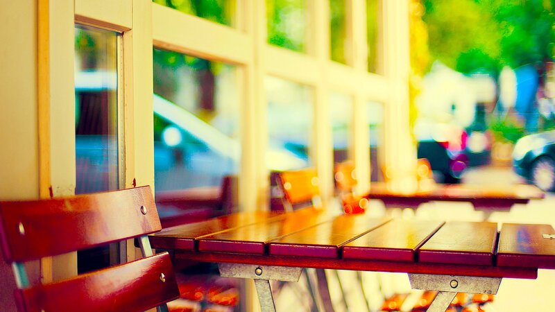 Empty outdoor cafe tables