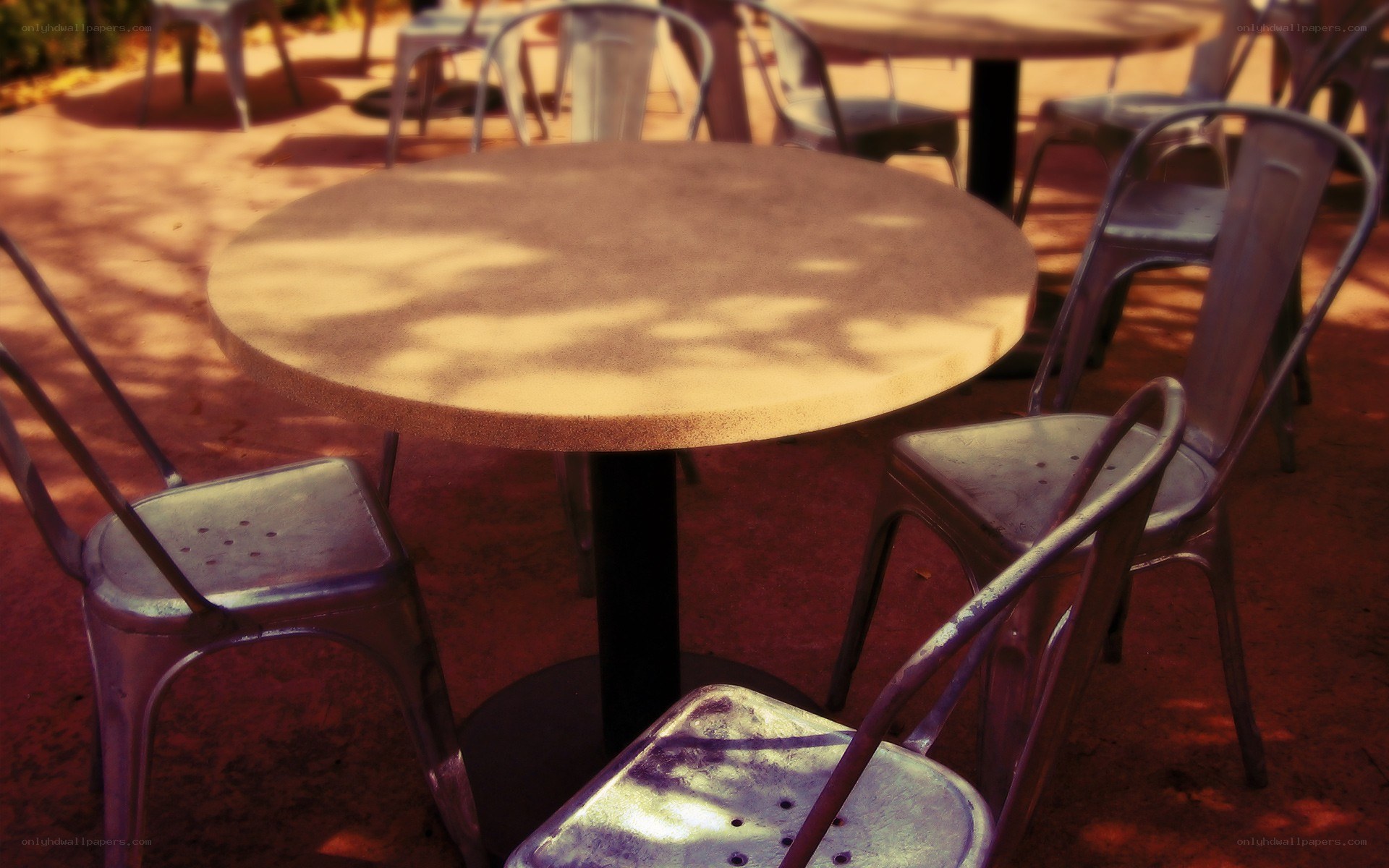 Empty outdoor tables and chairs
