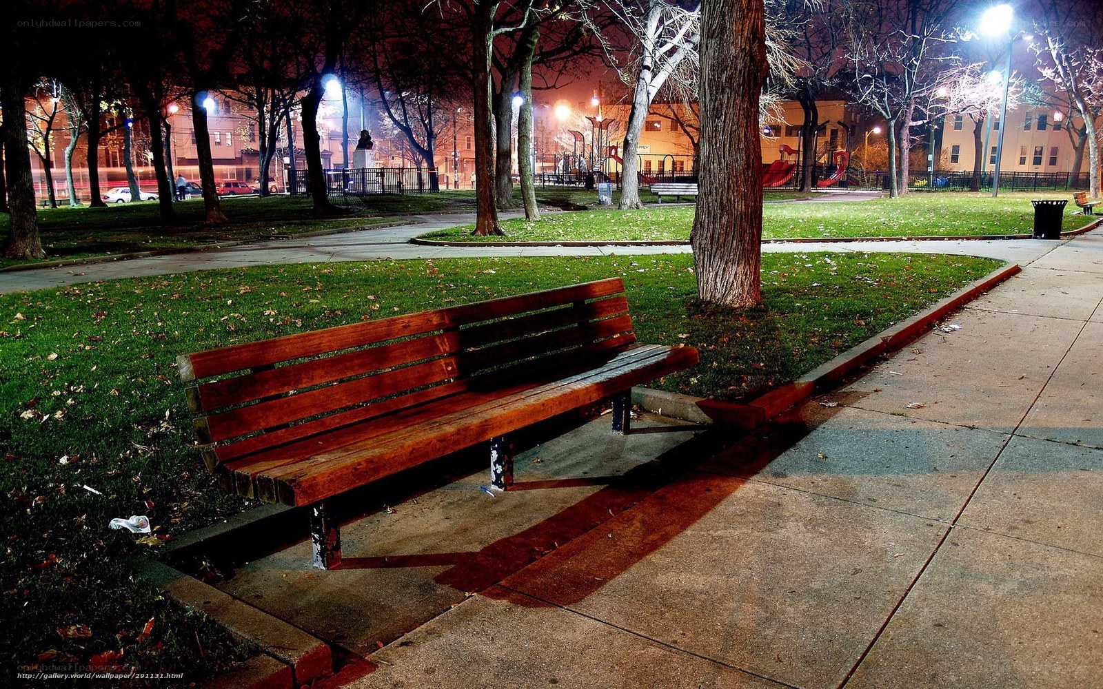 Empty park bench at night