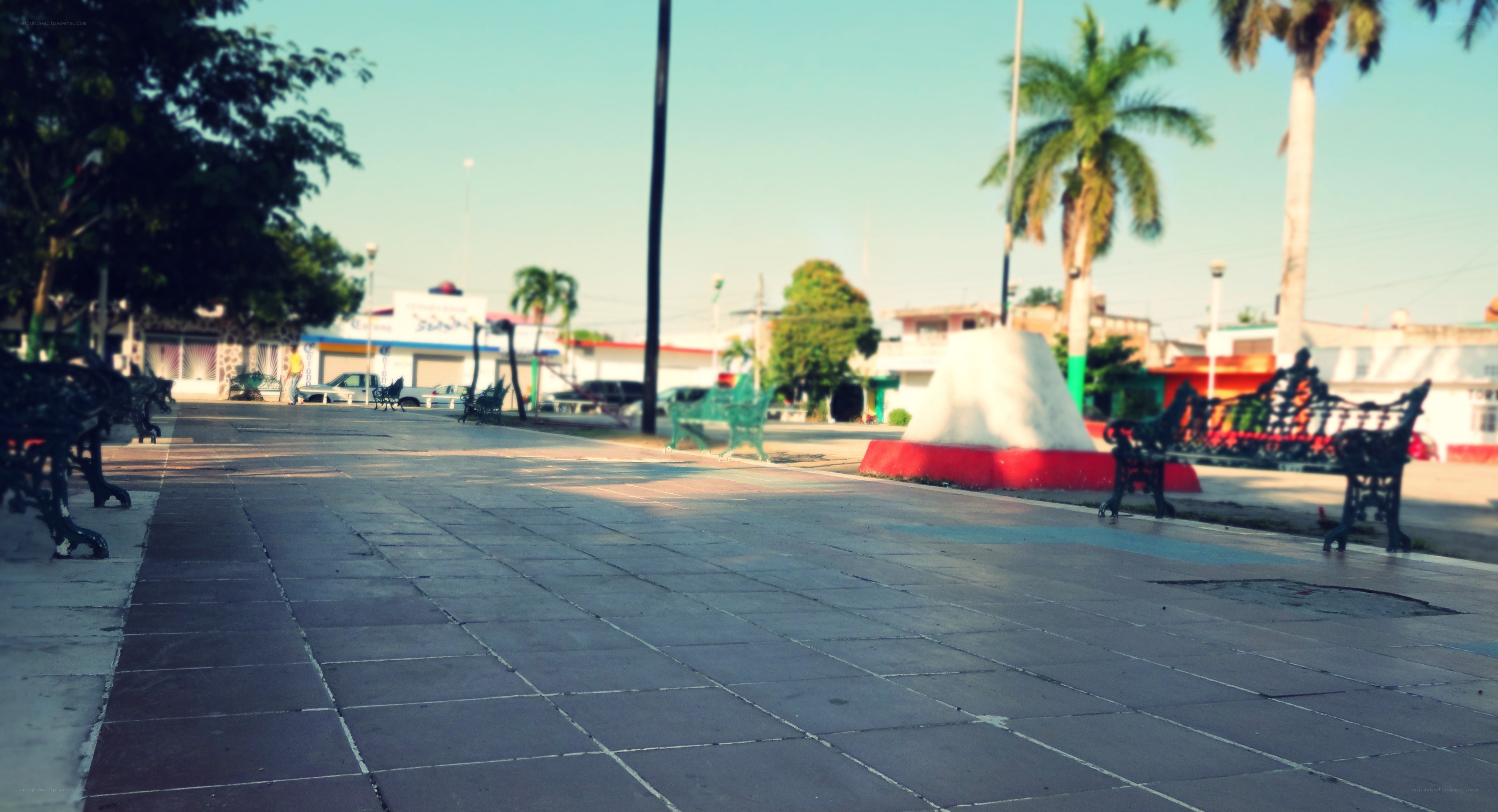Empty park with benches and fountain