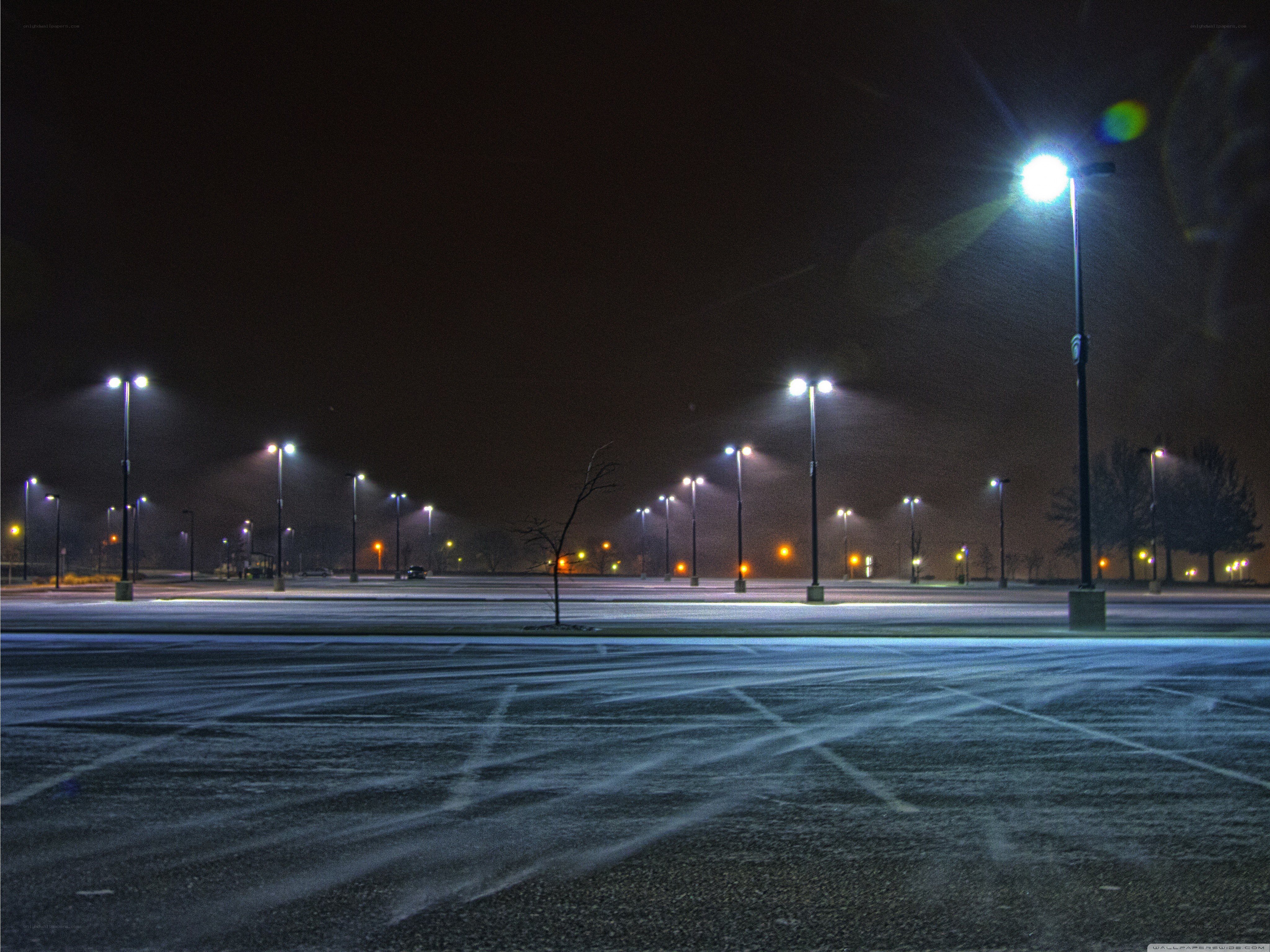 Empty parking lot at night
