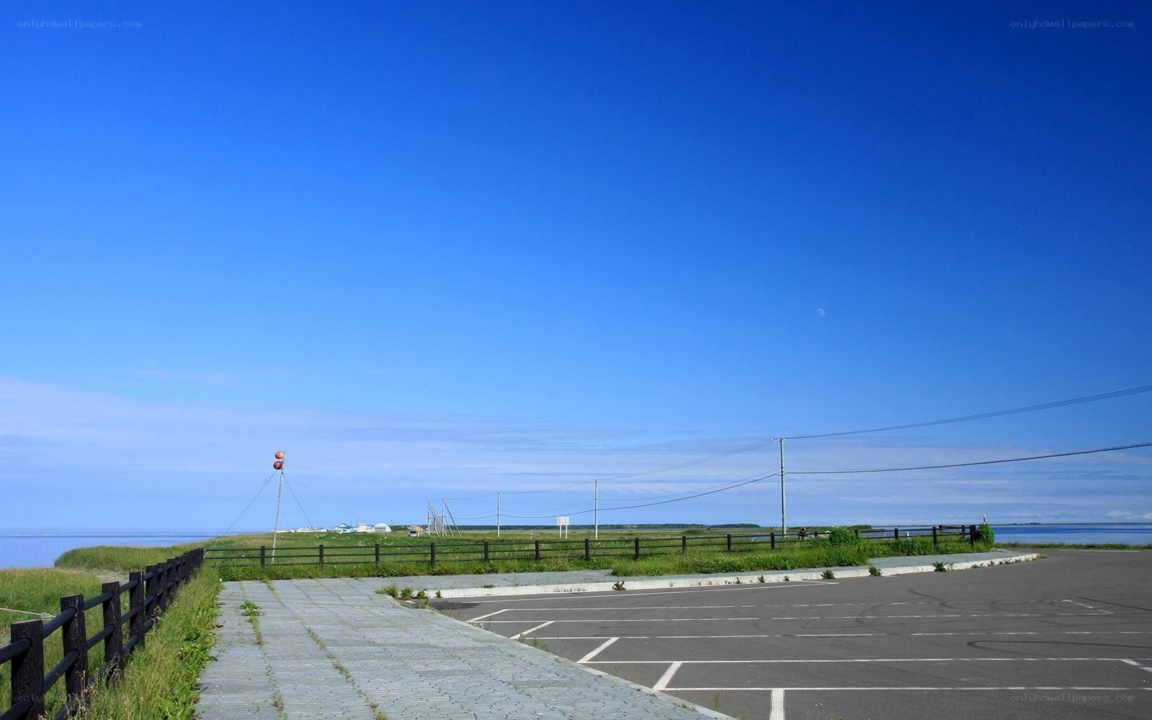 Empty parking lot by the sea