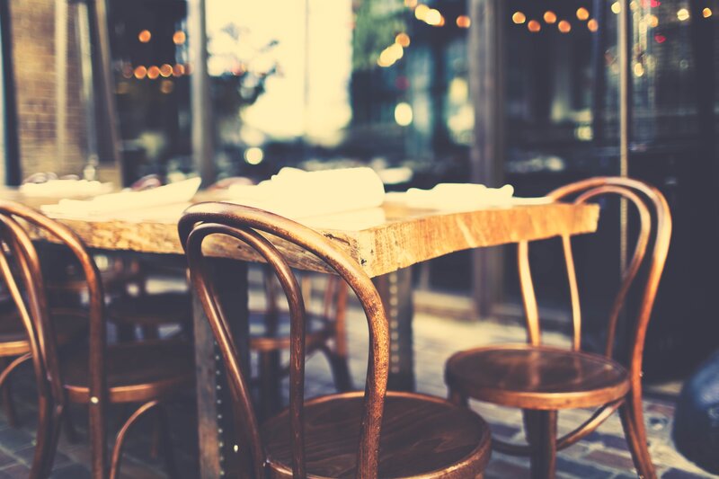 Empty restaurant tables at dusk