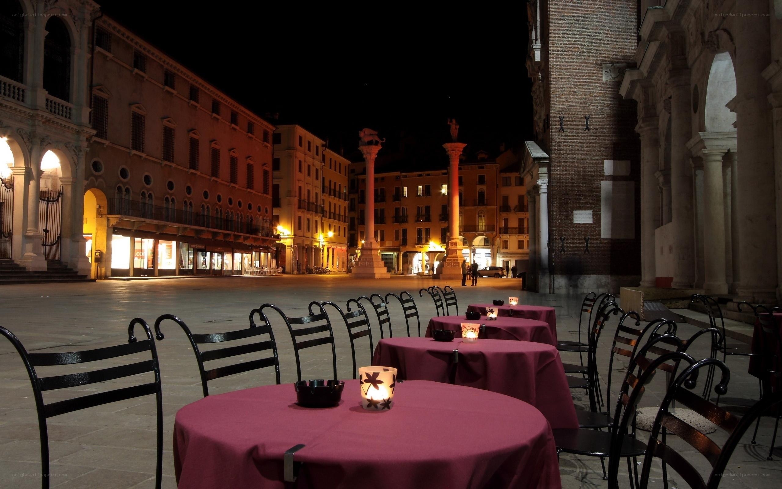 Empty restaurant tables in a European square
