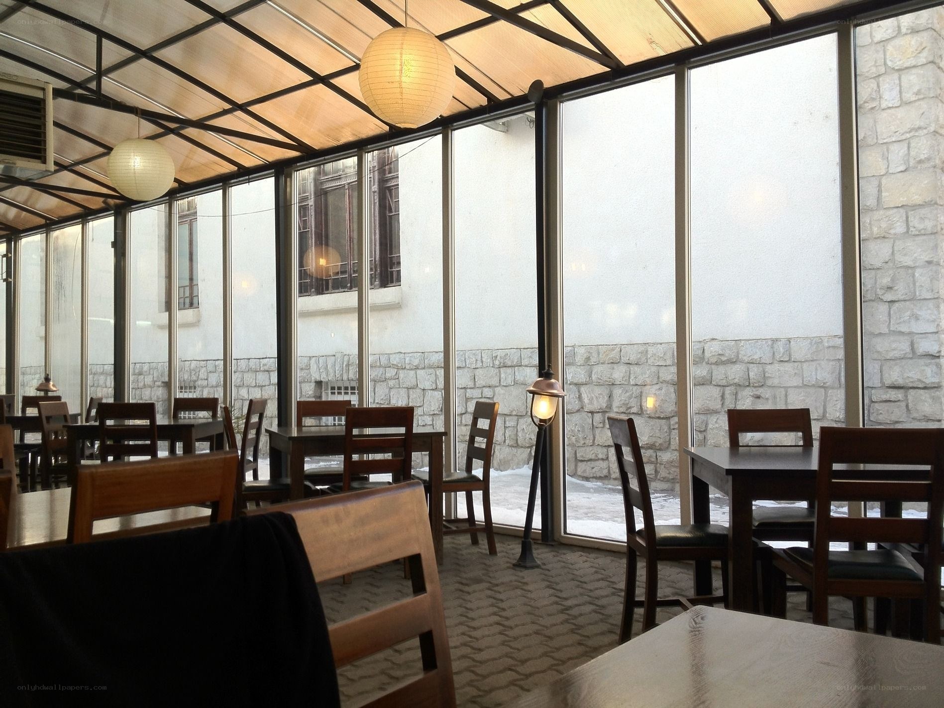 Empty restaurant with wooden tables