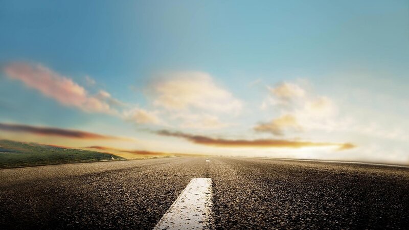 Empty road at sunset