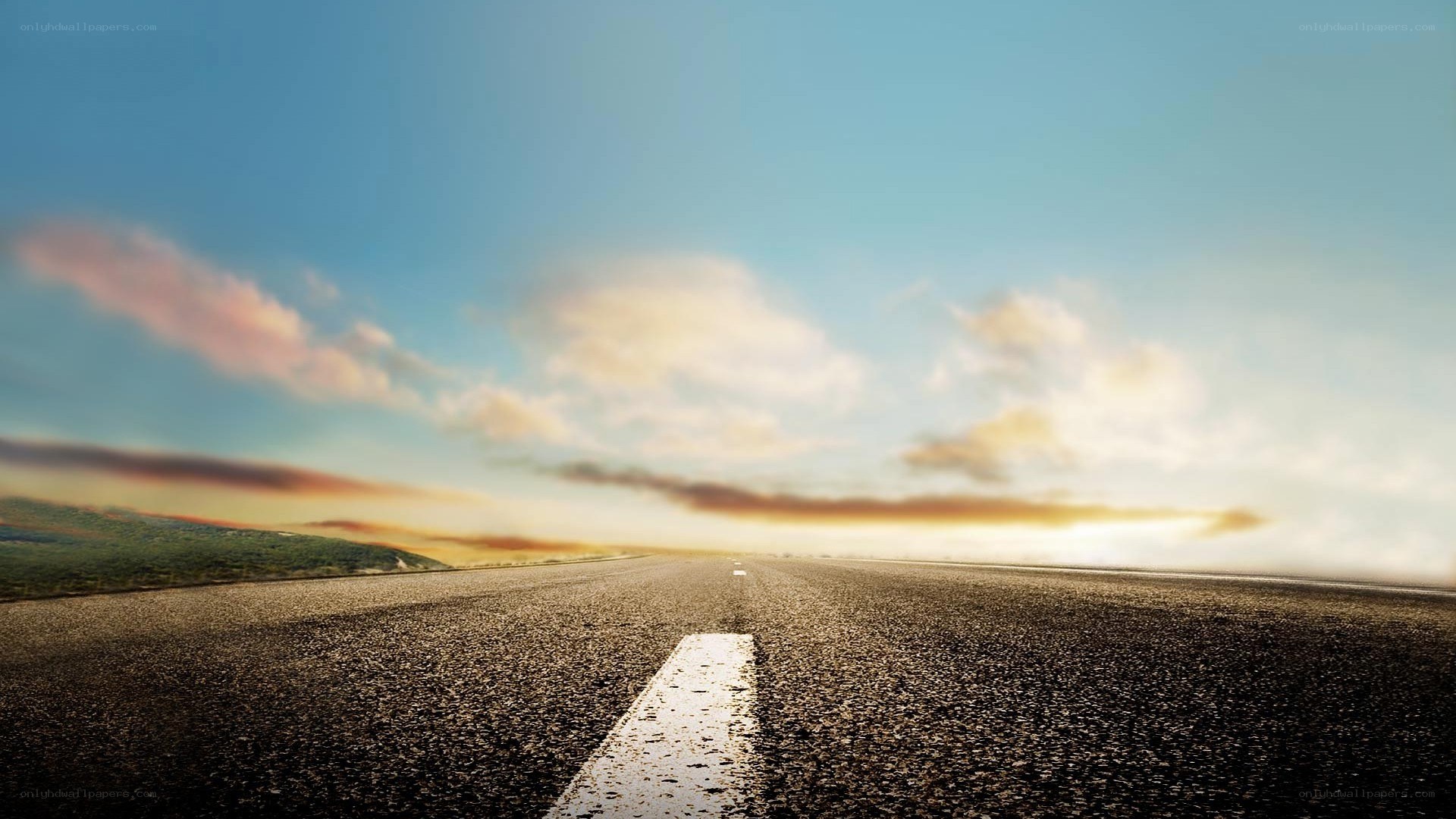 Empty road at sunset