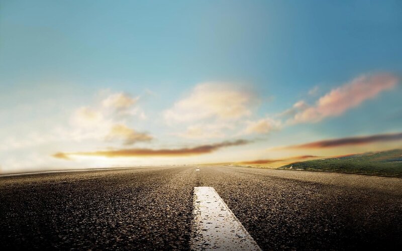 Empty road at sunset