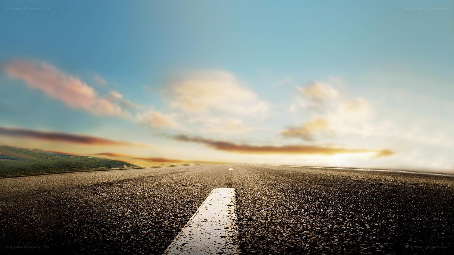 Empty road at sunset