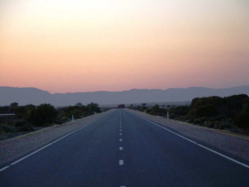 Empty road at sunset