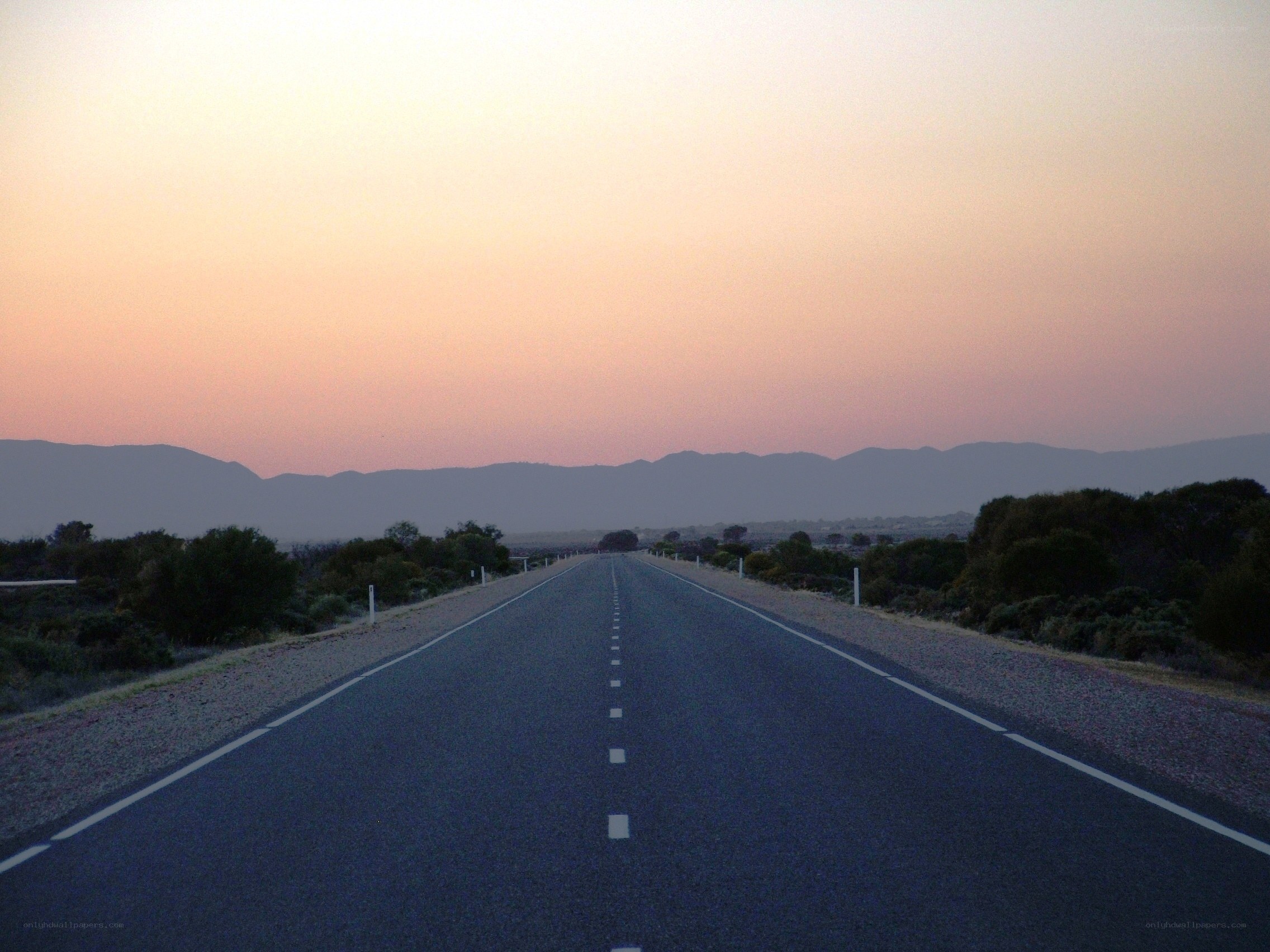Empty road at sunset