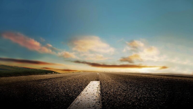 Empty road at sunset