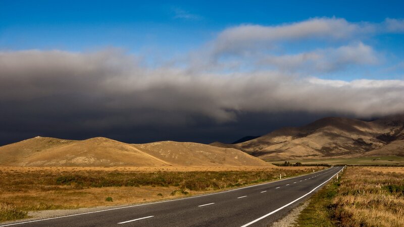 Empty Road in Desert — Blue, Dramatic, Afternoon, Photograph, Hills