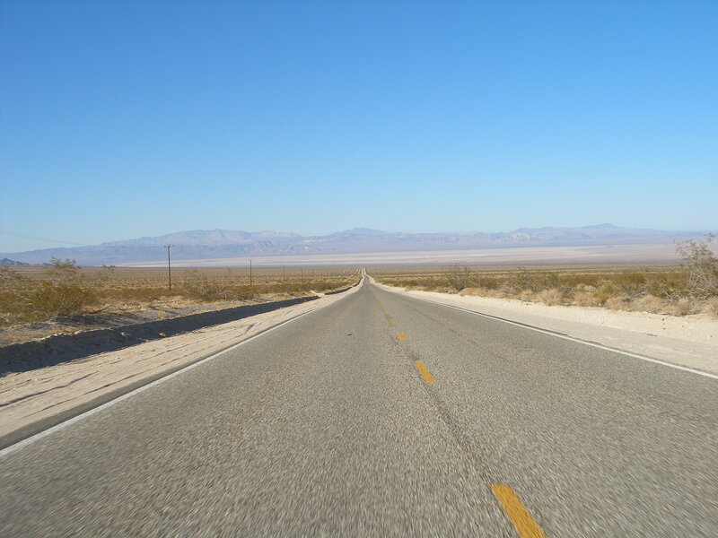 Empty Road in Desert — Blue, Serene, Afternoon, Photograph, Mountains, Sky, Gray
