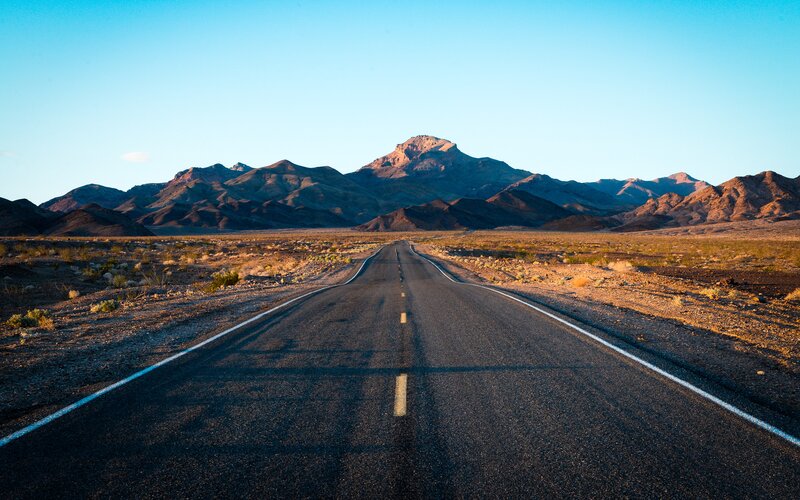 Empty Road in Desert — Blue, Serene, Sunset, Photograph