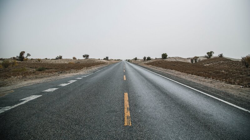 Empty Road in Desert — Gray, Desolate