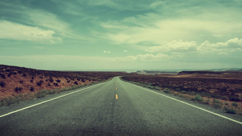 Empty road in desert landscape