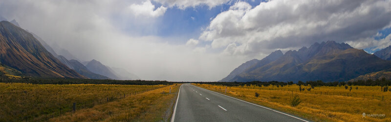 Empty Road in Mountain Valley