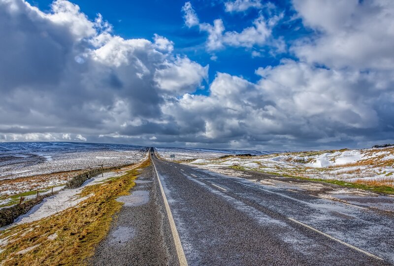 Empty Road in Snowy Landscape