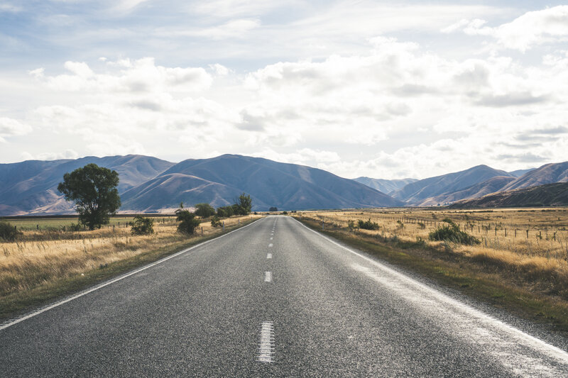 Empty Road in Valley — Gray
