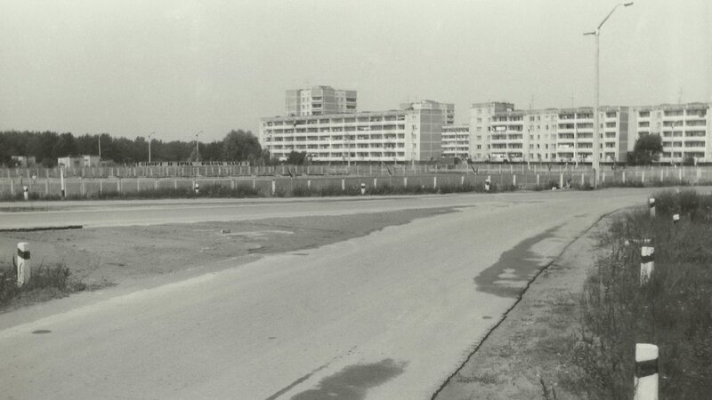 Empty road near apartment buildings
