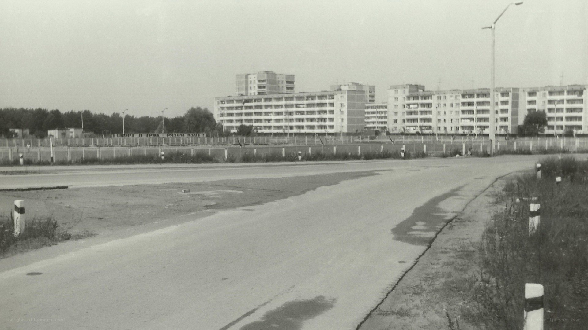 Empty road near apartment buildings
