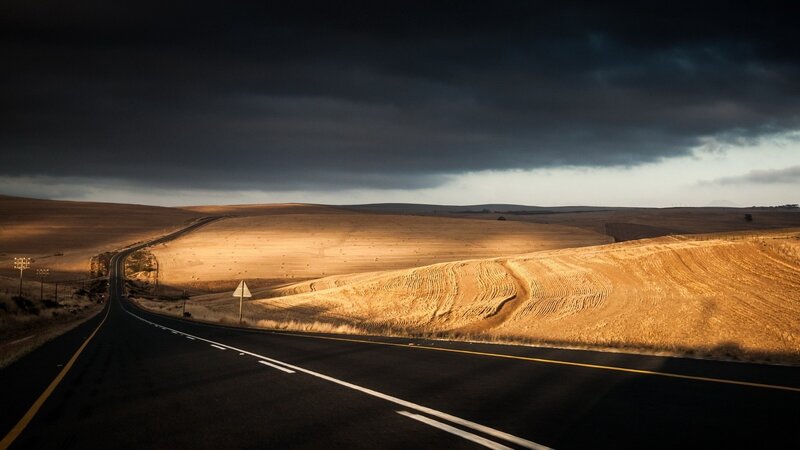 Empty Road Through Fields — Black, Dramatic