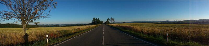 Empty Road Through Fields — Blue, Serene, Morning