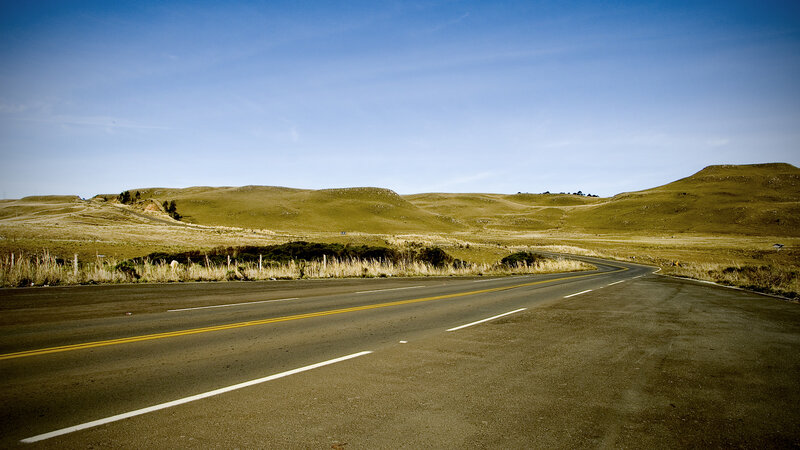 Empty road through rolling hills