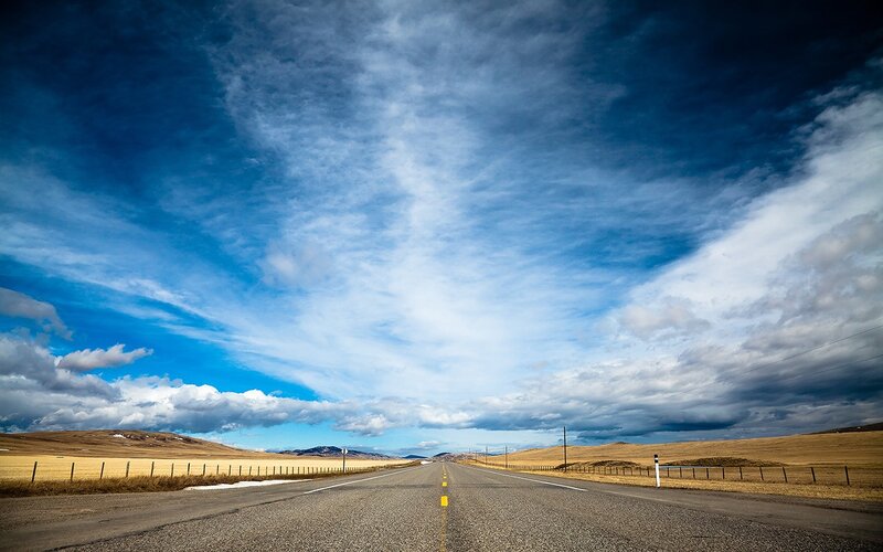 Empty Road under Cloudy Sky — Blue