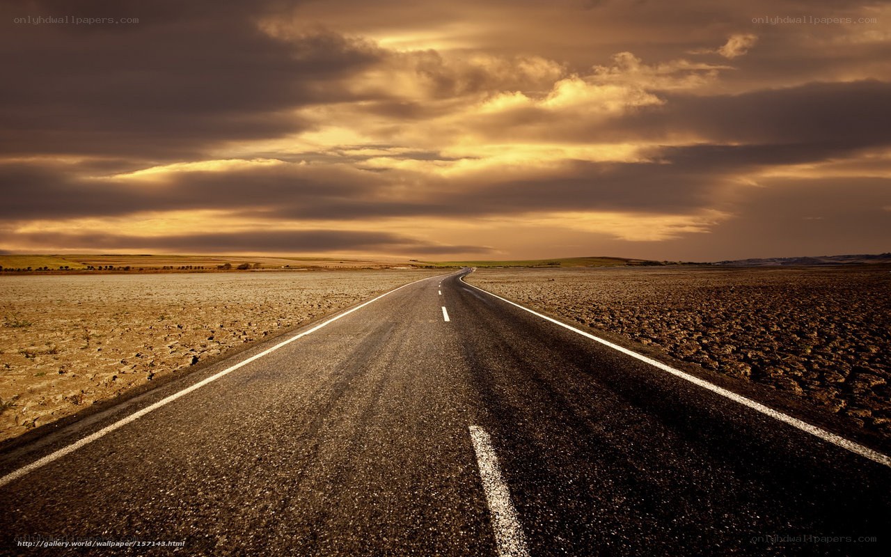 Empty road under golden sky