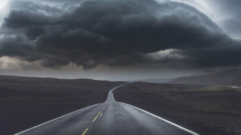 Empty Road under Storm Clouds — Gray