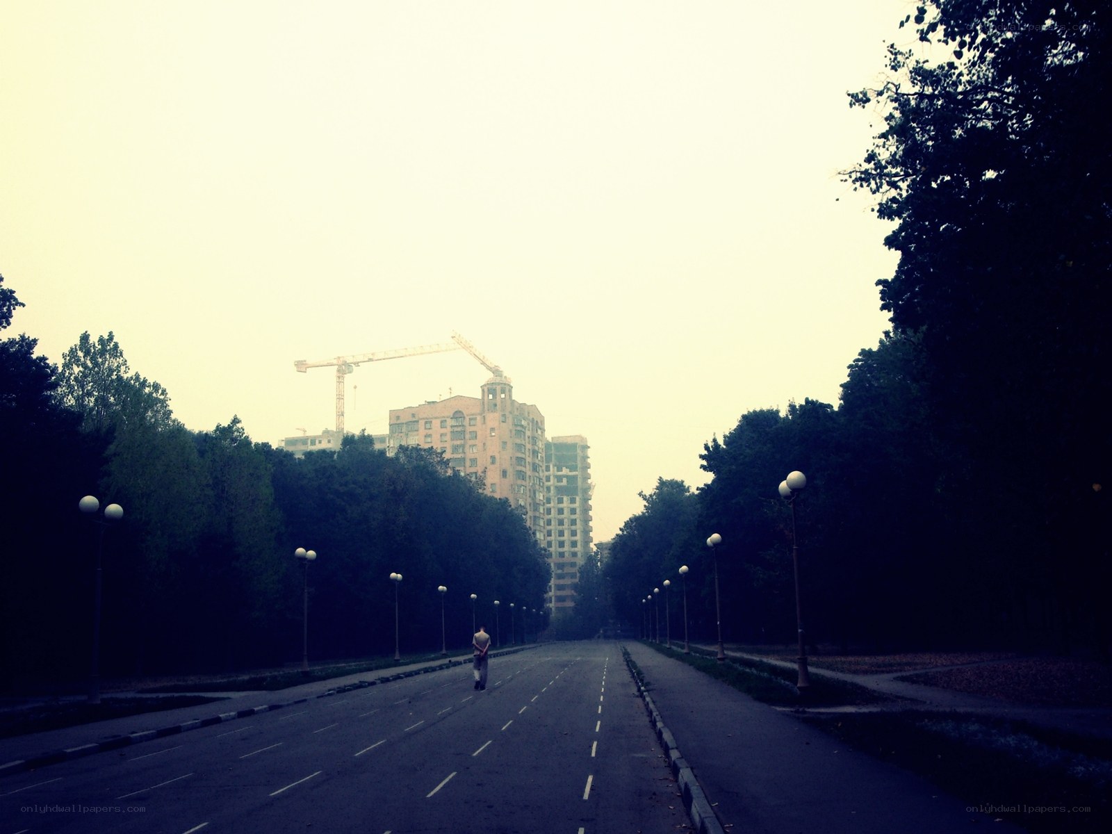 Empty road with construction in distance