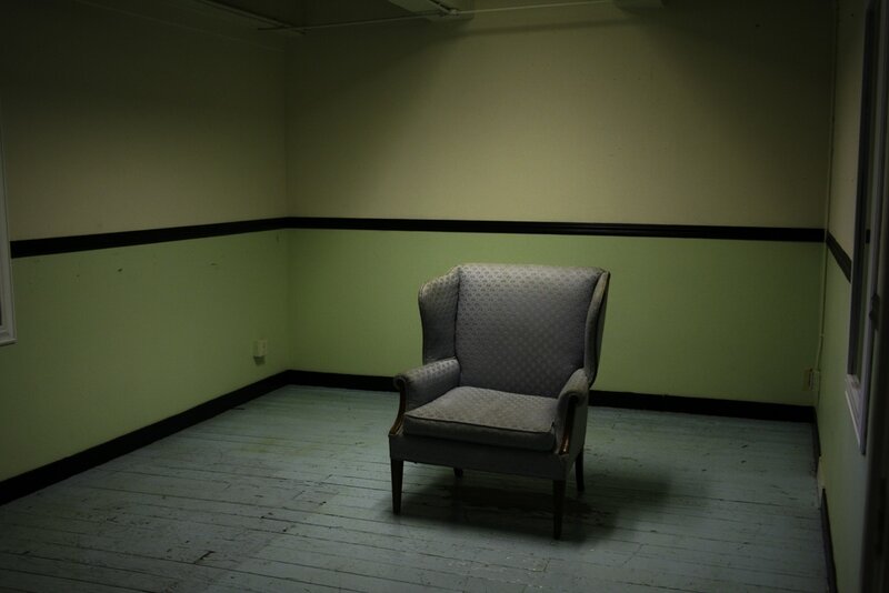 Empty room with a single armchair