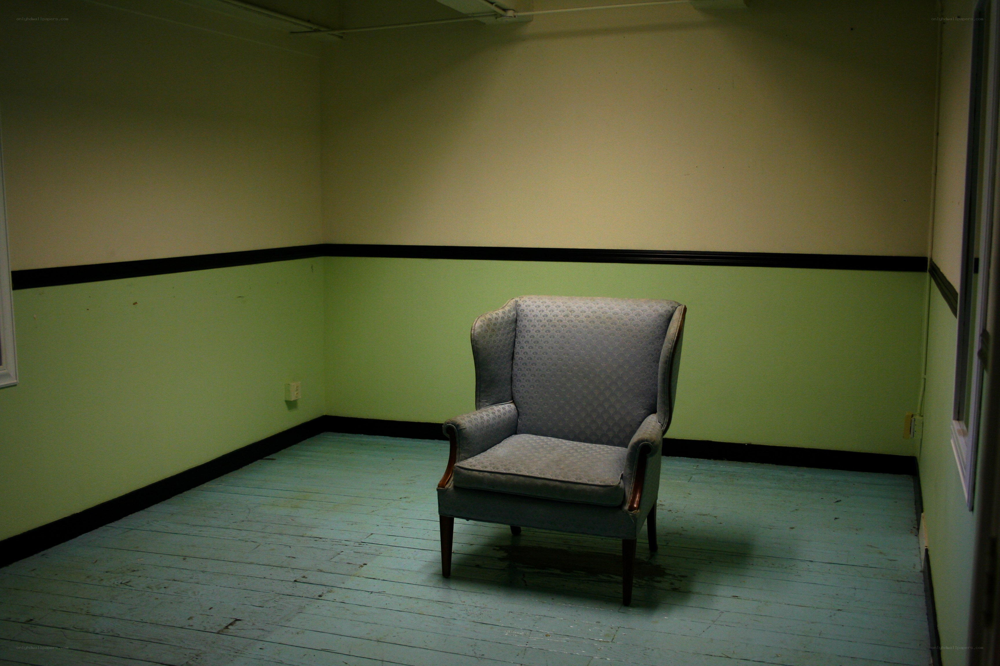 empty room with armchair