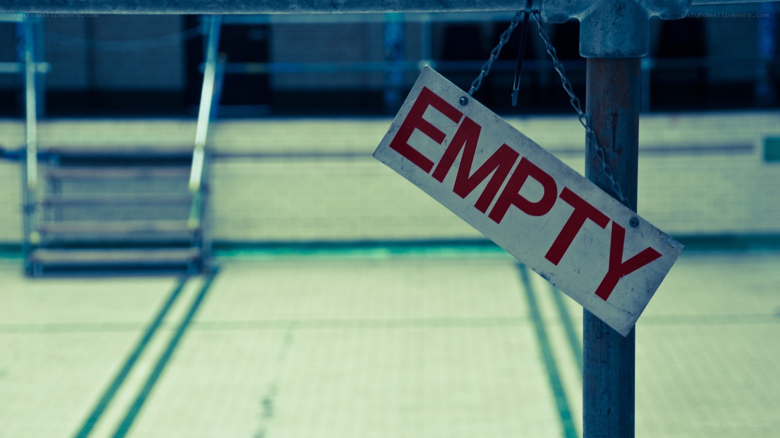Empty sign at poolside