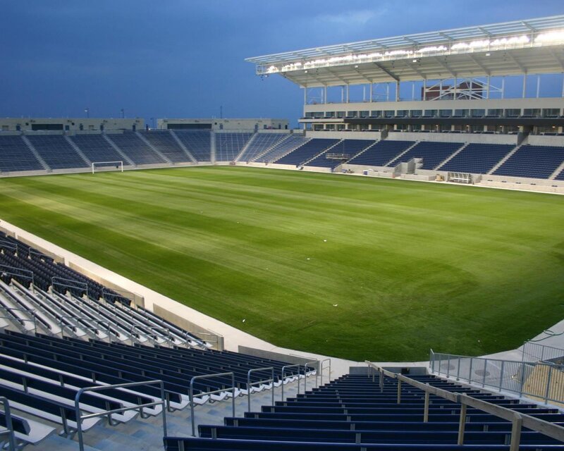 empty soccer stadium at dusk