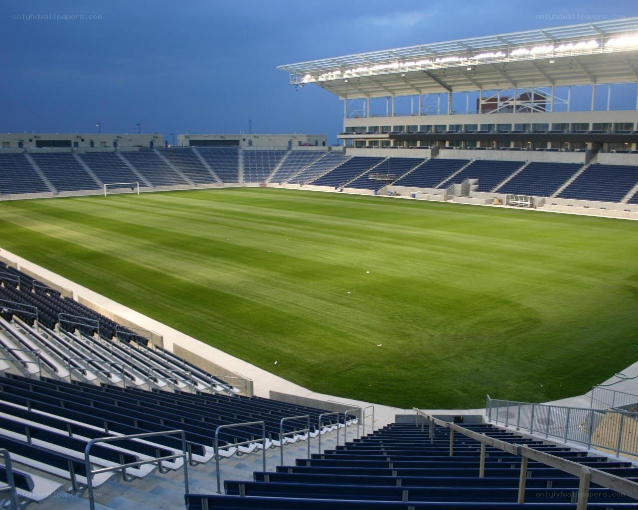 empty soccer stadium at dusk