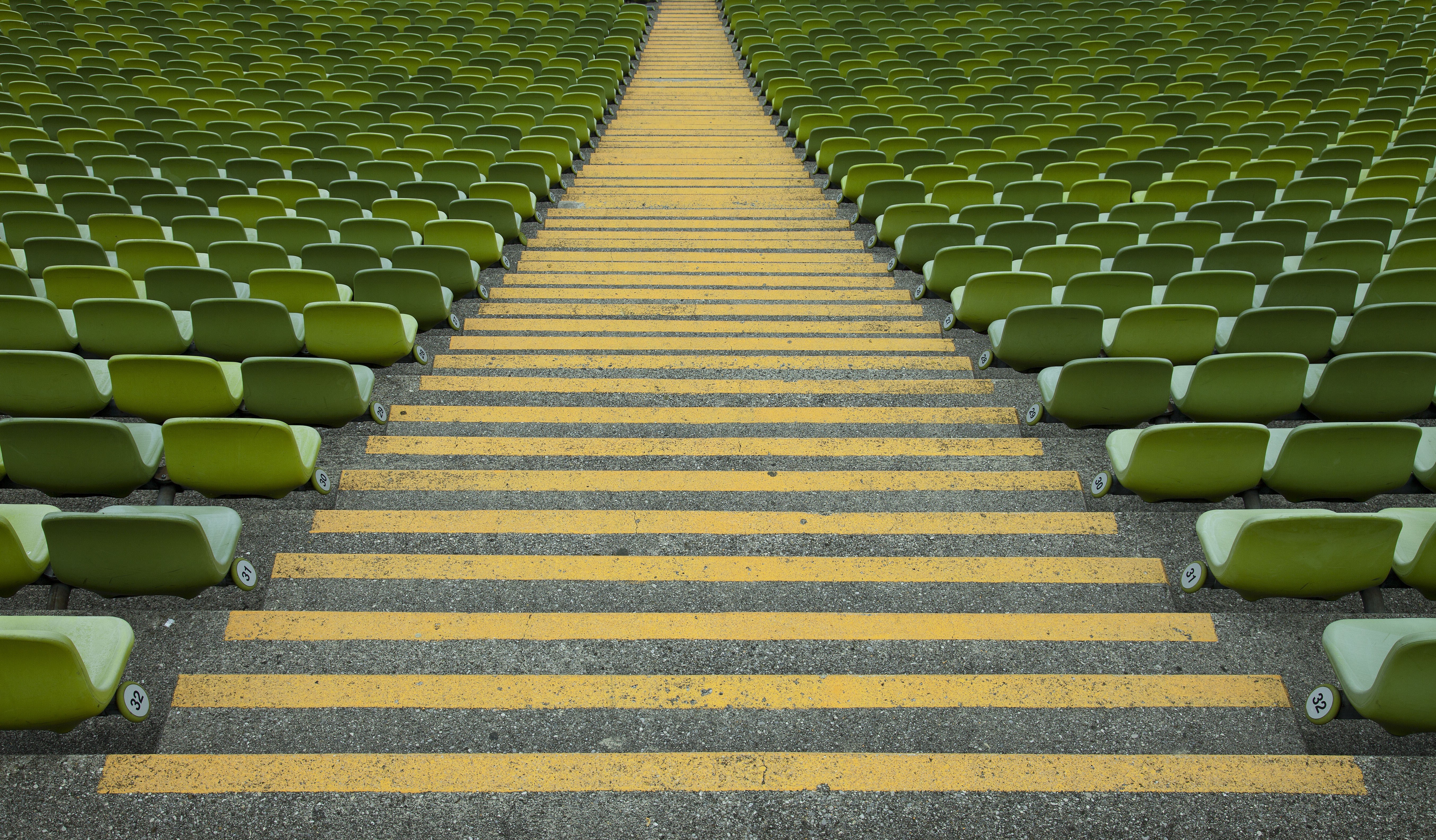 Empty stadium seats and yellow steps