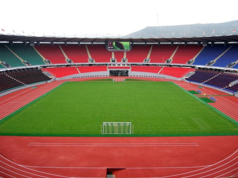 empty stadium with green field