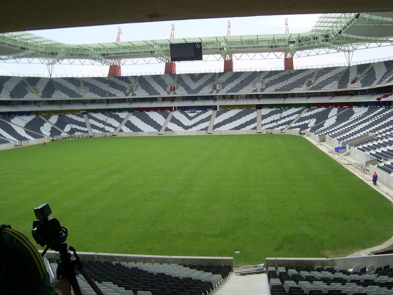 empty stadium with green field