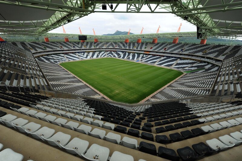 empty stadium with green field