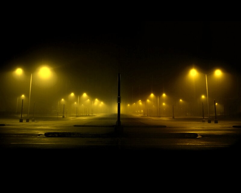 Empty street at night in fog