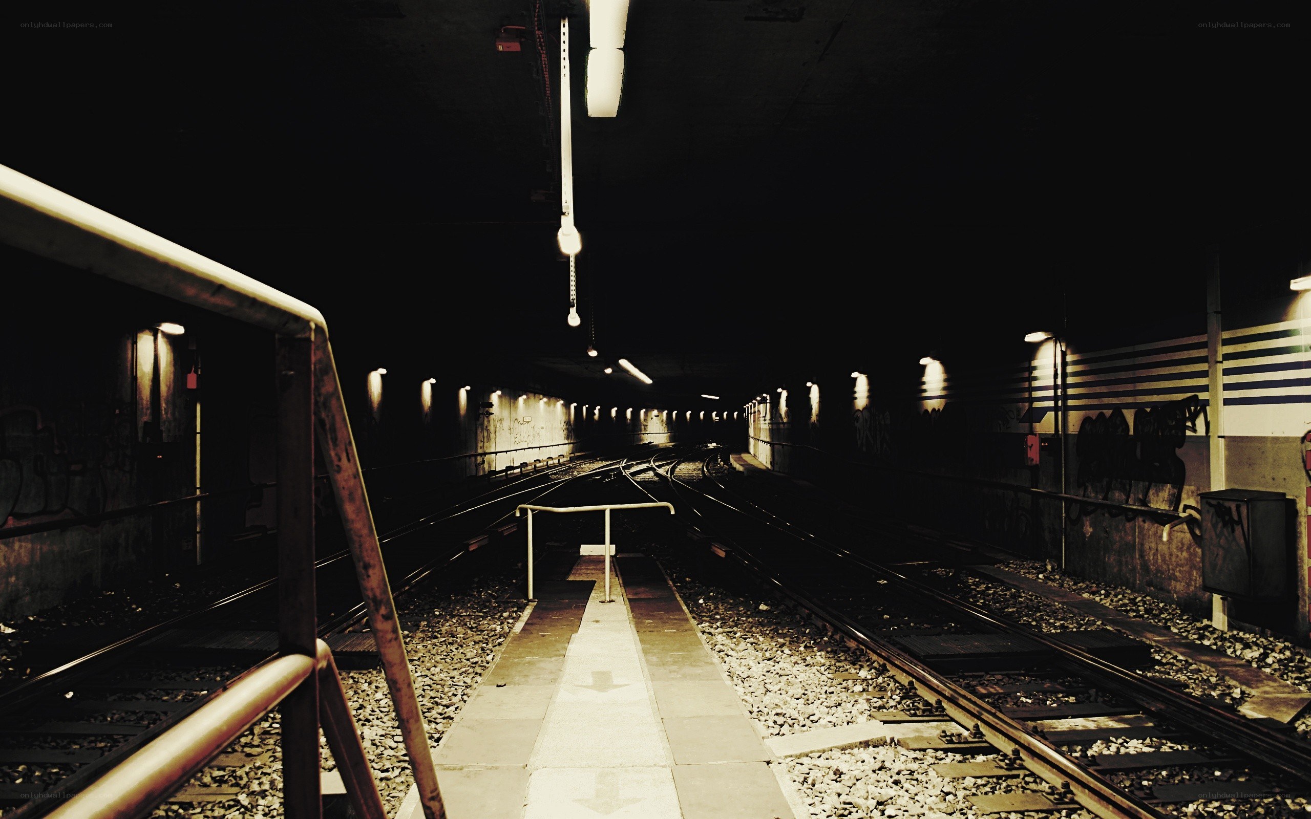 Empty subway tunnel at night
