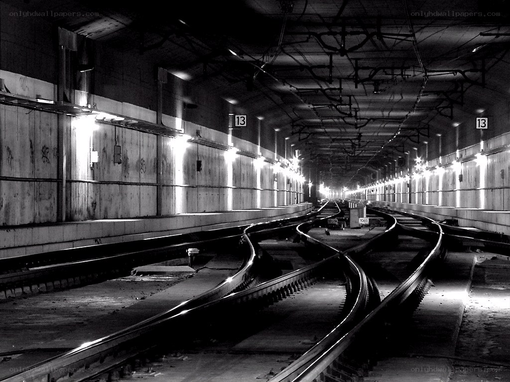 Empty subway tunnel with tracks