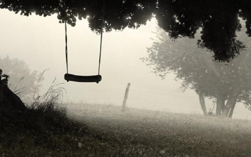 Empty Swing in Fog